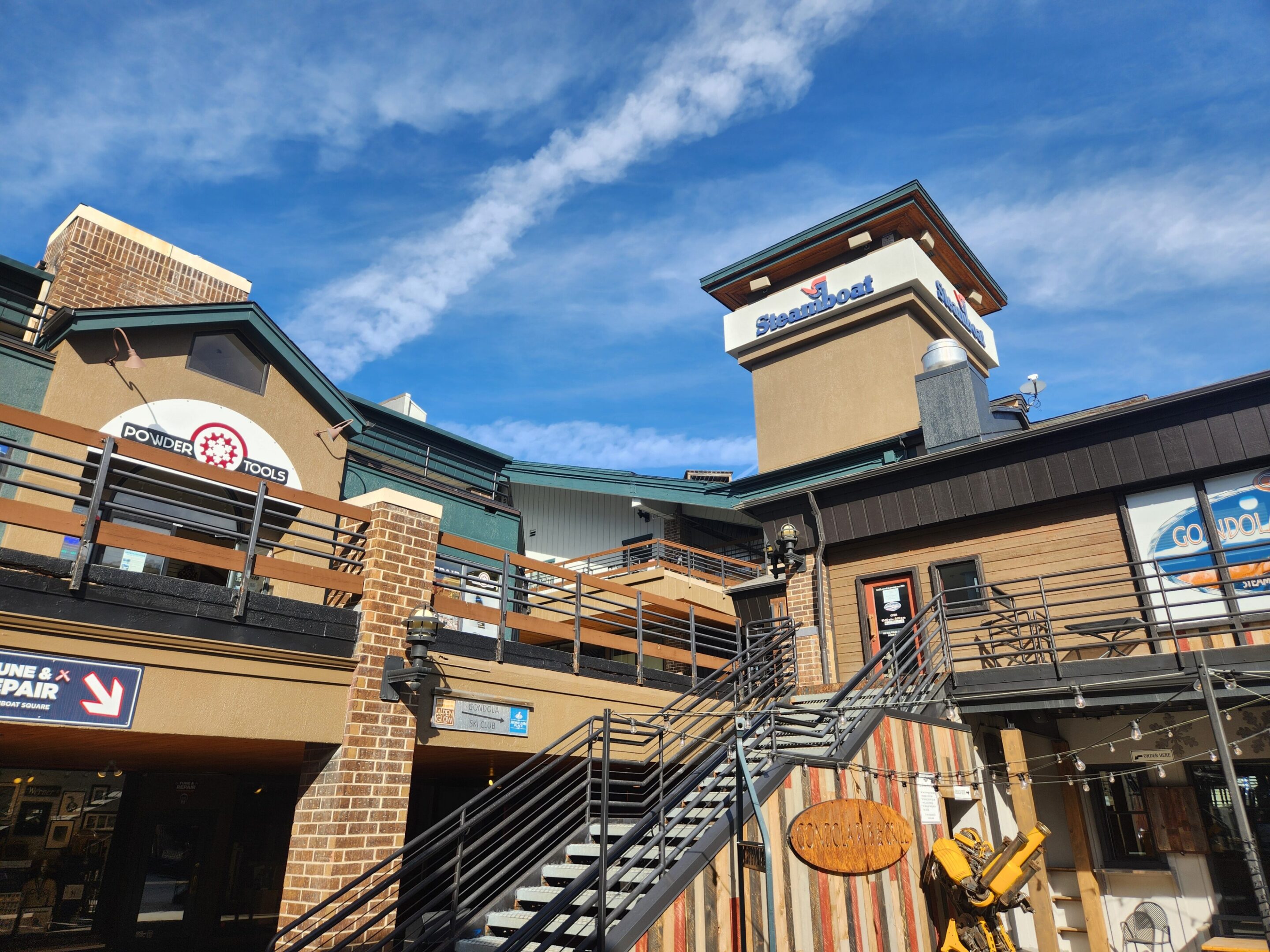 Brick and wood storefronts with stairs