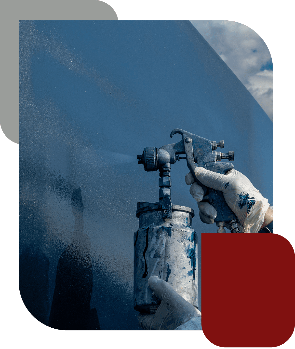 Hand using spray paint gun