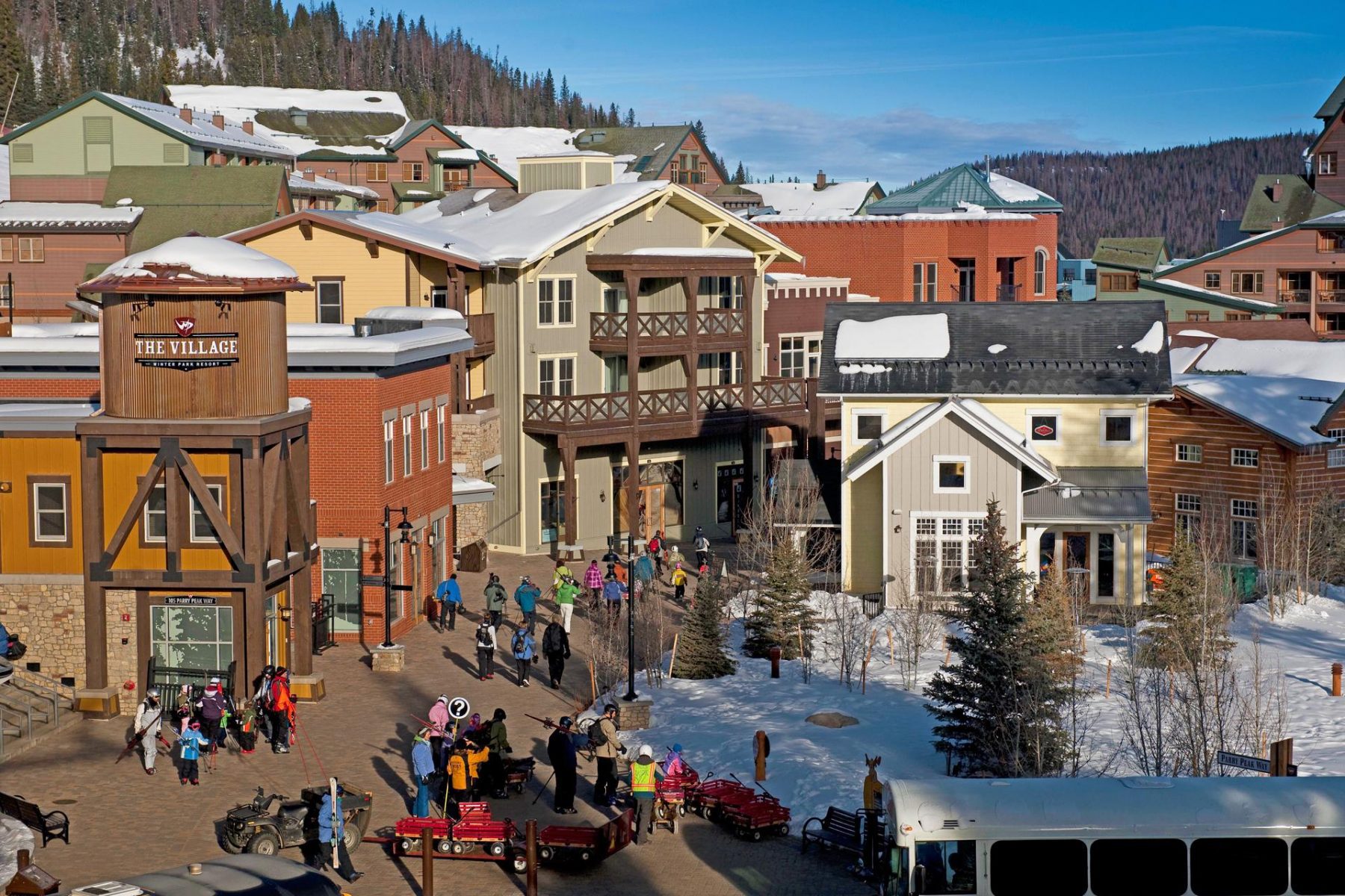 People walking in snowy village street