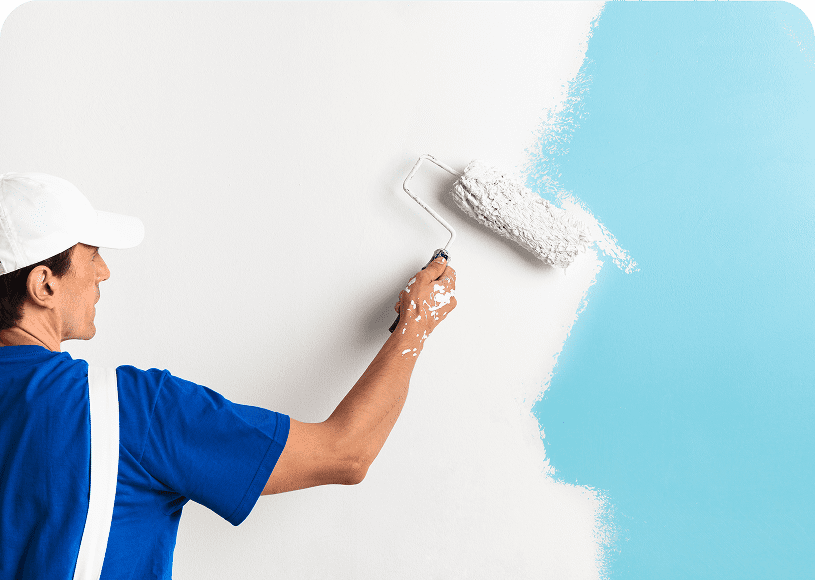 Man painting wall white and blue.