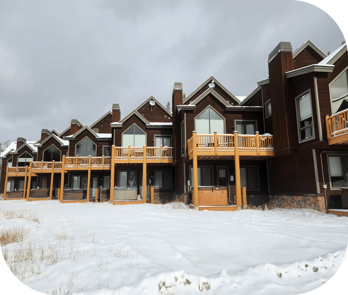 Rustic cabins in winter landscape